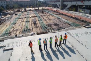 construction workers lined up on building project