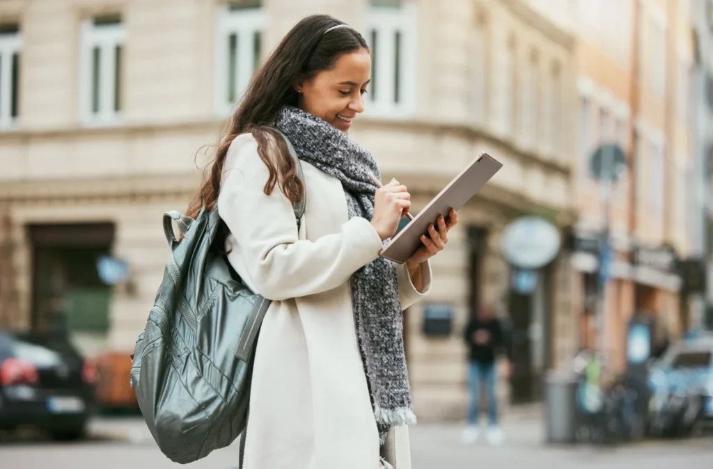 woman happily filling out an online survey on her iPad for cash